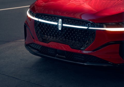 The available front LED light bar and center Lincoln Star logo glow at dusk. | Palmetto Lincoln in Charleston SC