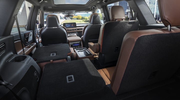 One side of the PowerFold® third-row seat and a second-row seat are folded forward in the 2026 Lincoln Aviator® SUV. | Palmetto Lincoln in Charleston SC