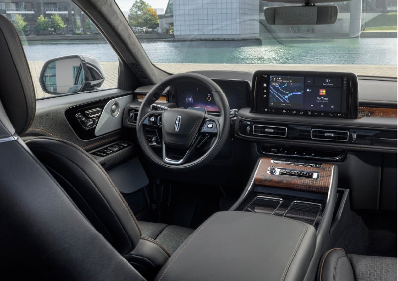 The interior of the 2026 Lincoln Aviator® SUV is shown parked with a view of a harbor through the windshield. | Palmetto Lincoln in Charleston SC