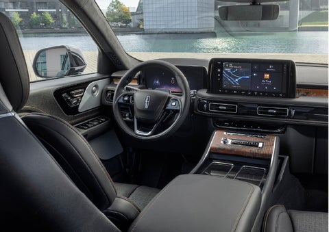 The interior of the 2026 Lincoln Aviator® SUV is shown parked with a view of a harbor through the windshield. | Palmetto Lincoln in Charleston SC