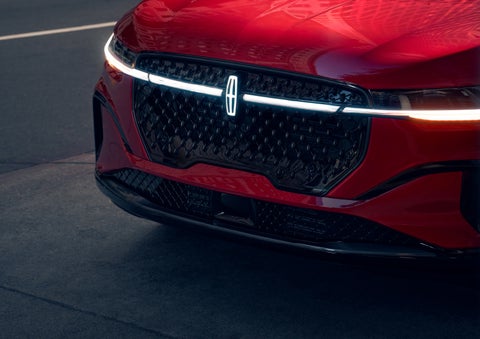 The available front LED light bar and center Lincoln Star logo glow at dusk. | Palmetto Lincoln in Charleston SC