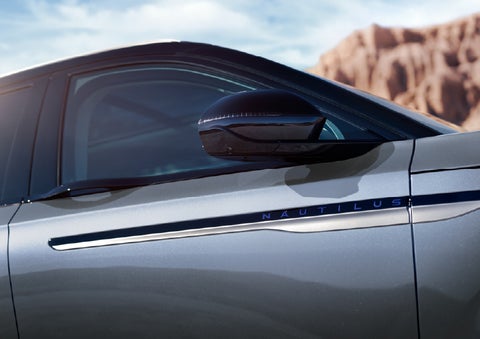 Blue lettering on the side of the vehicle that reads Nautilus indicates the available Hybrid Powertrain. | Palmetto Lincoln in Charleston SC