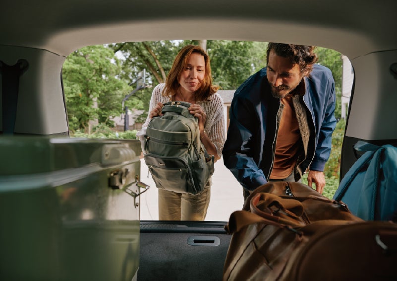 A couple loads luggage into the rear of a 2027 Lincoln Aviator® Black Label™ SUV..e 202 | Palmetto Lincoln in Charleston SC
